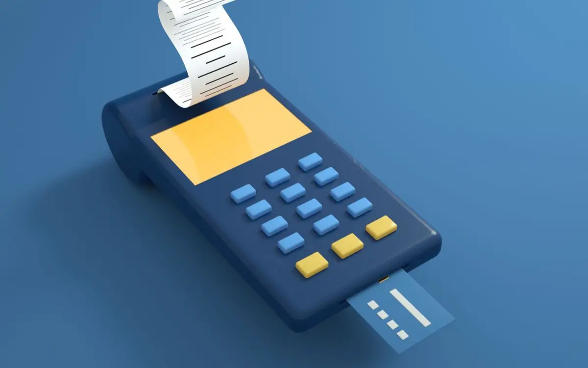 A blue card reader with a receipt printout and inserted card